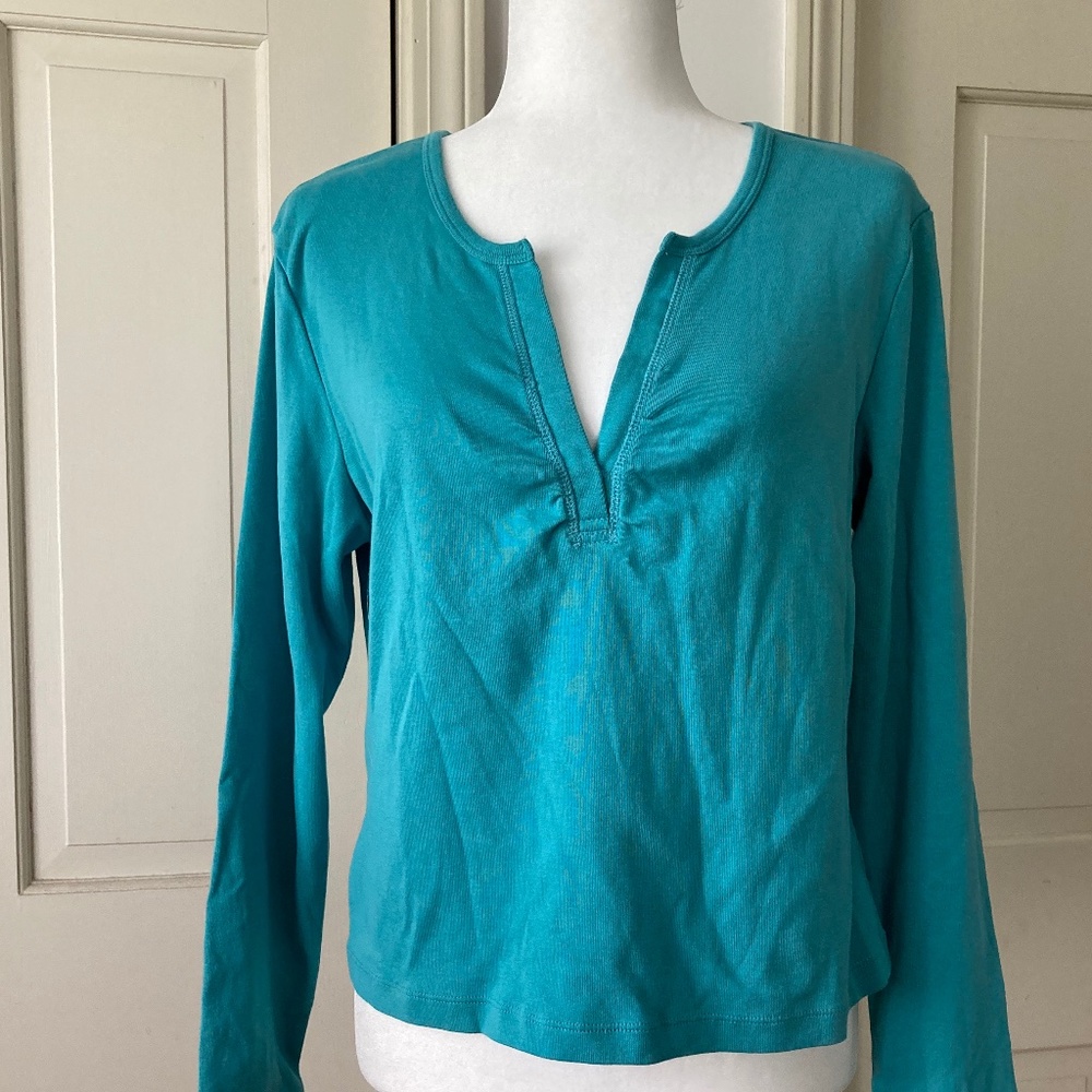 Woman long sleeve knit shirt.